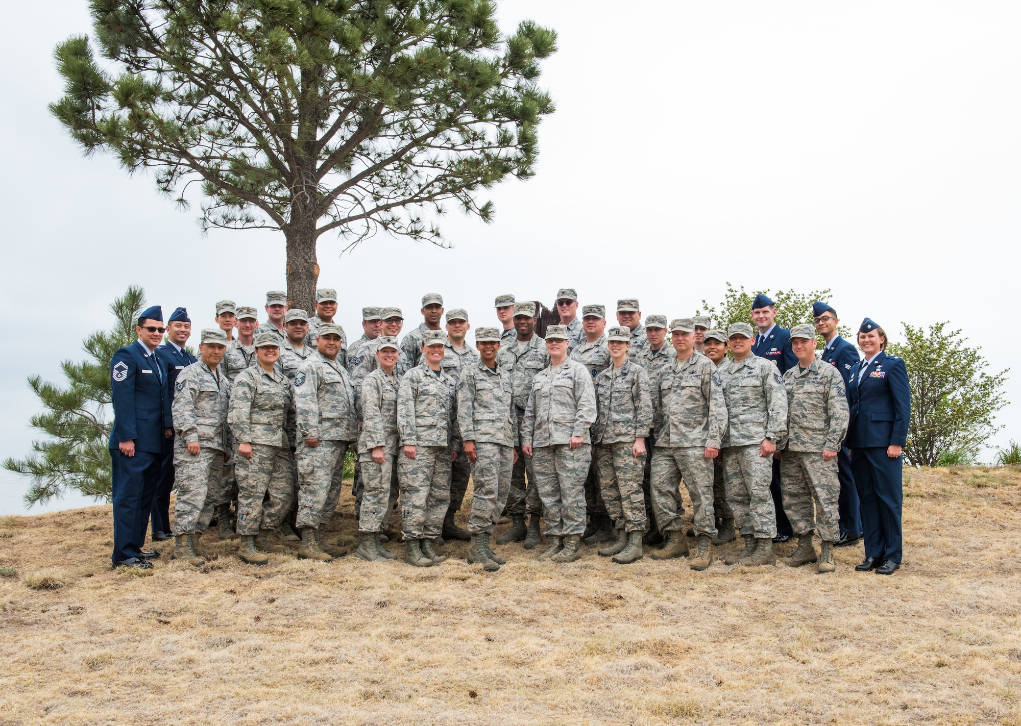 Members of the 19th Space Operations Squadron pose for a group photo with incoming commander, Lt. Col. Beth Stargardt, before the 19 SOPS Change of Command, June 3, 2018.
