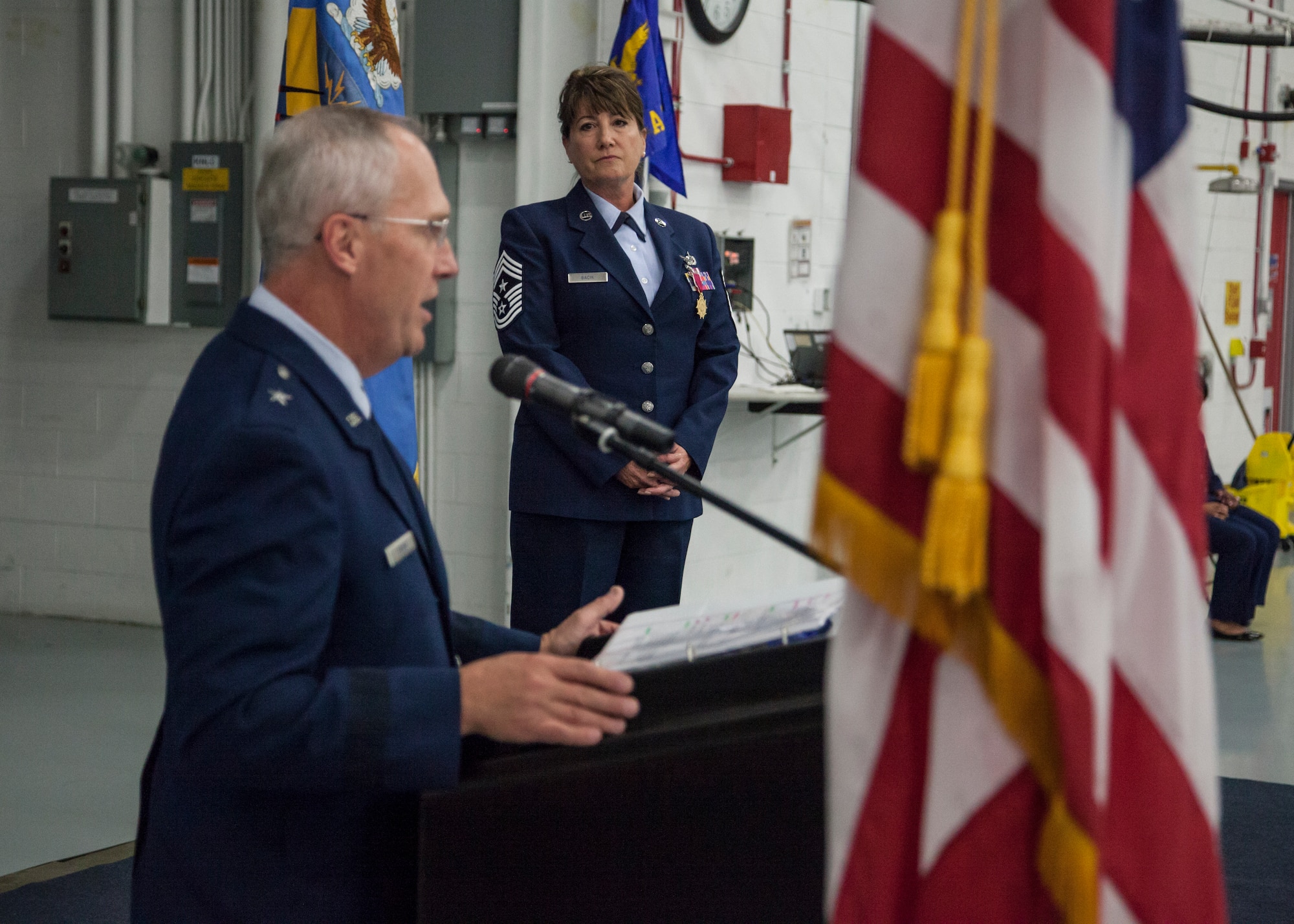 U.S. Air Force Brig. Gen. Gary Ebben speaks after presenting Command Chief Master Sgt. Connie Back with the Legion of Merit Award during a change of authority ceremony at the 128th Air Refueling Wing, Wisconsin Air National Guard, Oct. 14, 2017.