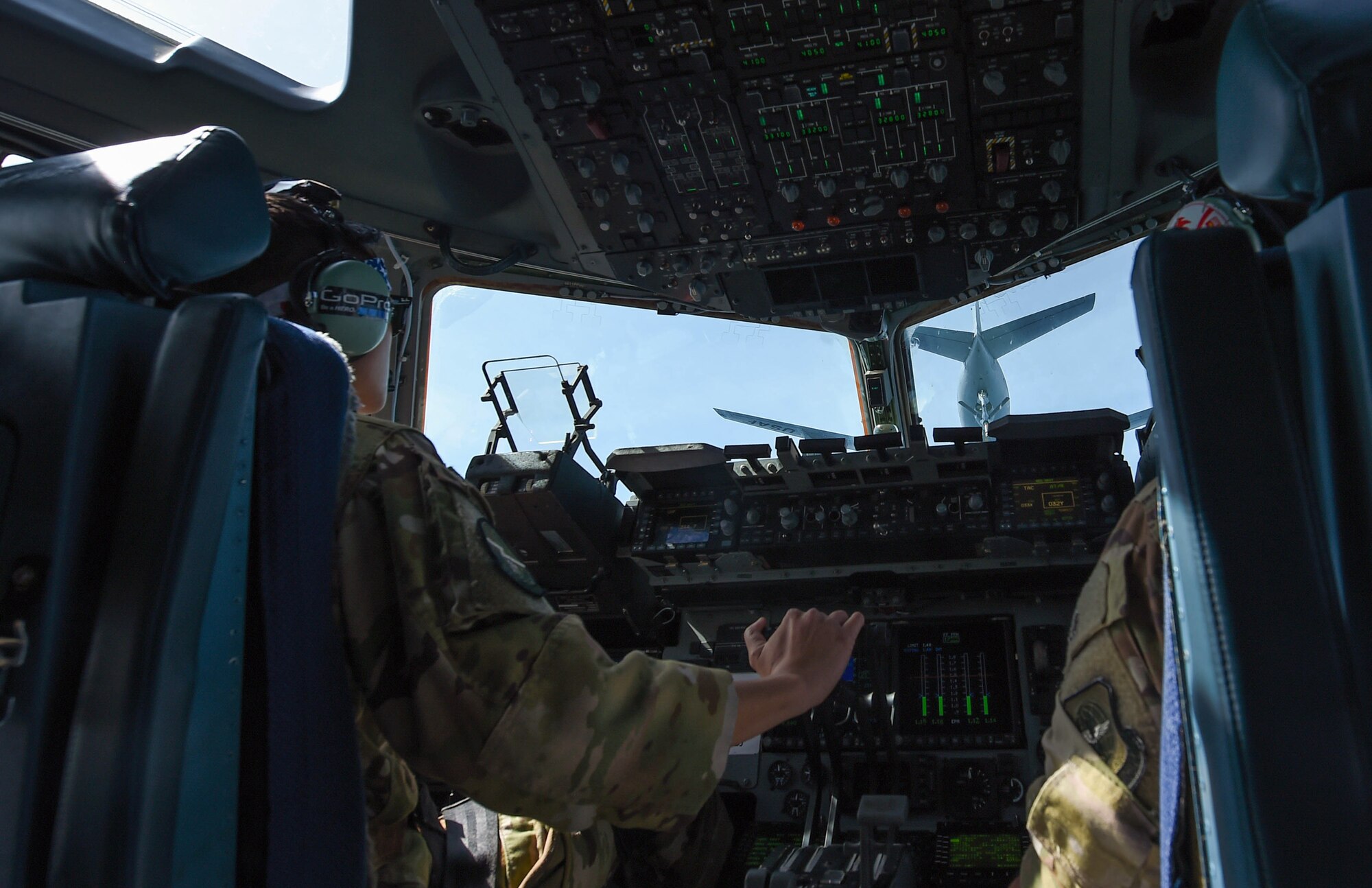 Capt. Tate Montgomery, 7th Airlift Squadron pilot, flies a C-17 Globemaster III towards a KC-135 Stratotanker for refueling during Exercise Rainer War near Moses Lake, Wash., June 6, 2018. Three KC-135 Stratotankers participated in Exercise Rainier War to provide in-air refueling to the multiple C-17s executing tactical combat missions. (U.S. Air Force photo by Senior Airman Tryphena Mayhugh)