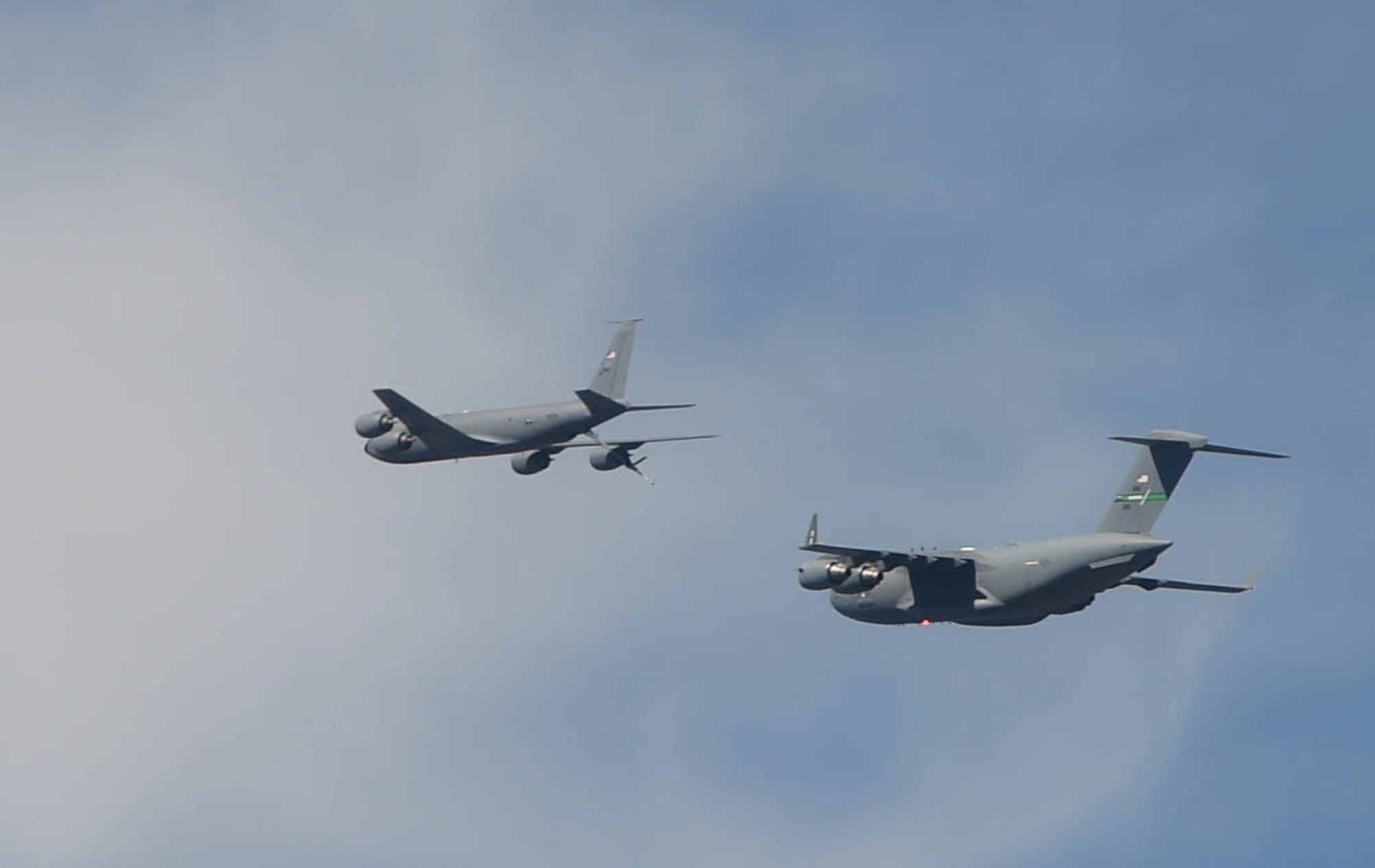 A C-17 Globemaster III, left, approaches a KC-135 Stratotanker for in-air refueling during Exercise rainier War near Moses Lake, Wash., June 6, 2018. Three KC-135 Stratotankers participated in Exercise Rainier War to provide in-air refueling to the multiple C-17s executing tactical combat missions. (U.S. Air Force photo by Senior Airman Tryphena Mayhugh)