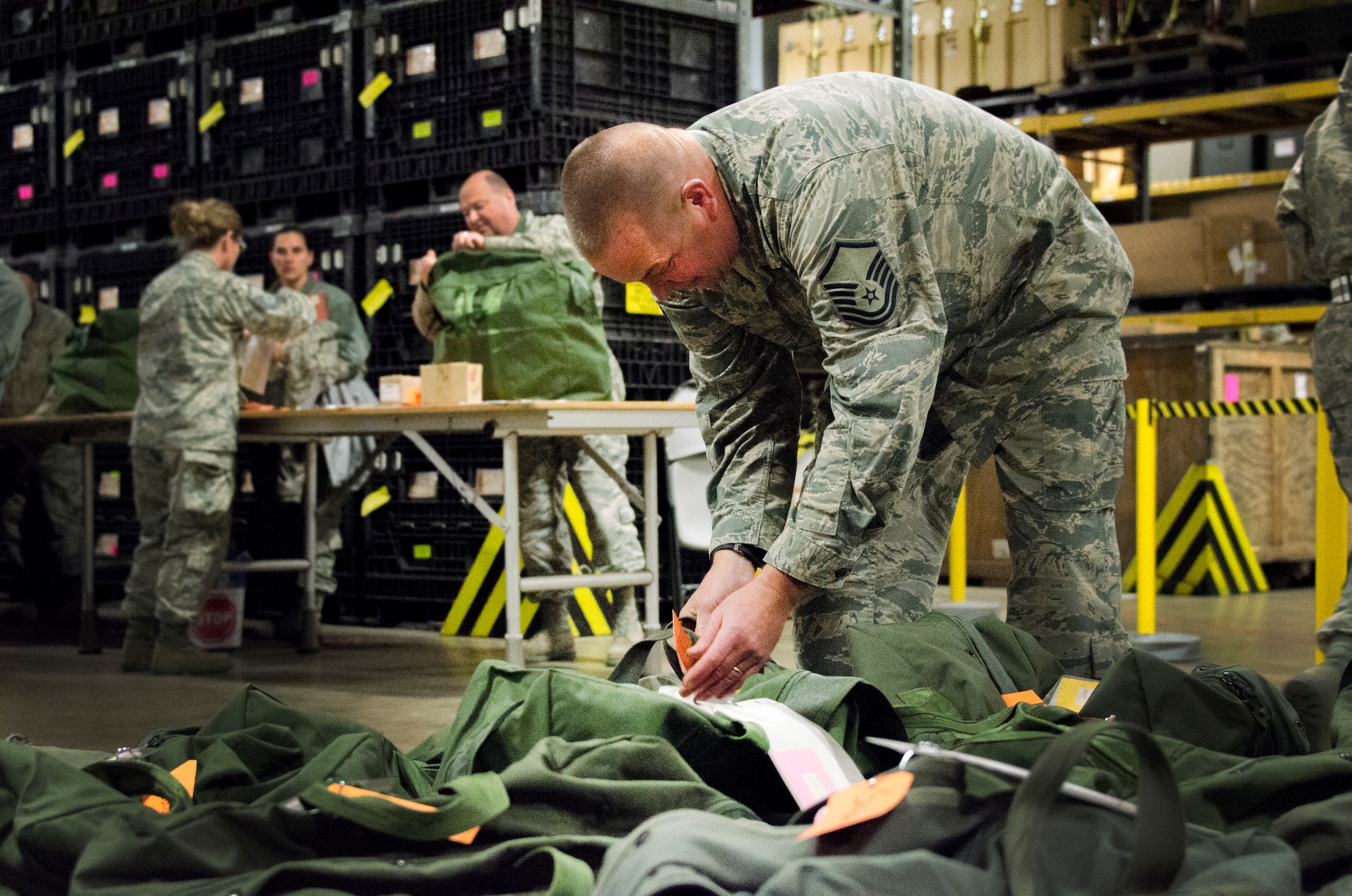 An Airman tags a deployment mobility bag during a generation exercise at the 128th Air Refueling Wing, Wisconsin Air National Guard, Nov. 5, 2017.