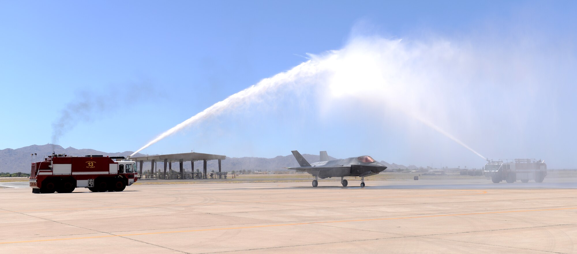 Brig. Gen. Brook Leonard, 56th Fighter Wing commander, taxis his F-35A Lightning II through an arch of water in celebration of his final sortie at Luke Air Force Base, Ariz., June 8, 2018. A commander’s final flight at an assignment is an occasion steeped in tradition and celebration. (U.S. Air Force photo by Senior Airman Ridge Shan)