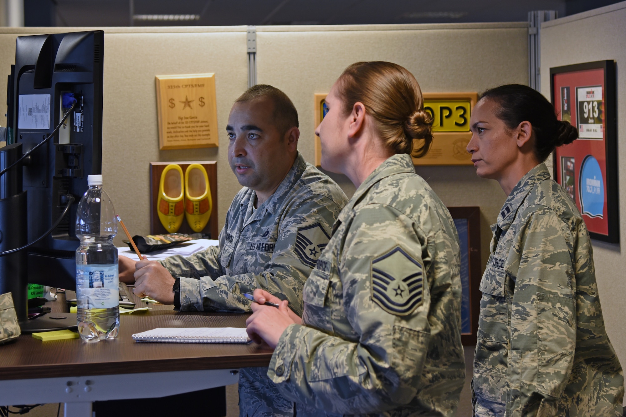 Airmen from the 161st and 48th Comptroller Squadrons work together to complete travel vouchers during a two-week training exercise at Royal Air Force Lakenheath, England May 30, 2018. The Arizona Air National Guard Airmen spent two weeks working alongside Airmen from the 48th CPTS to gain valuable knowledge and improve mission readiness. (U.S. Air National Guard photo by Staff Sgt. Dillon Davis)