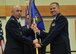 Col. Jeremy Hooper, right, accepts command of the 341st Medical Group from Col. Ron Allen, 341st Missile Wing commander, during an assumption of command ceremony June 12, 2018, at the Grizzly Bend at Malmstrom AFB, Mont. Guidon bearer Master Sgt. Josh Varner, 341st MDG first sergeant, looks on. (U.S. Air Force photo/John Turner)