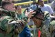 Maj. Logan Smith, left, 374th Civil Engineer Squadron operation flight commander, removes Senior Airman Felix Nunez, right, 374th CES electrical system technician, gas mask during an Ability to Survive and Operate (ATSO) Rodeo