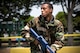 Senior Airman Antonio Gant, 374th Civil Engineer Squadron armorer, sprints into position during an Ability to Survive and Operate (ATSO) Rodeo