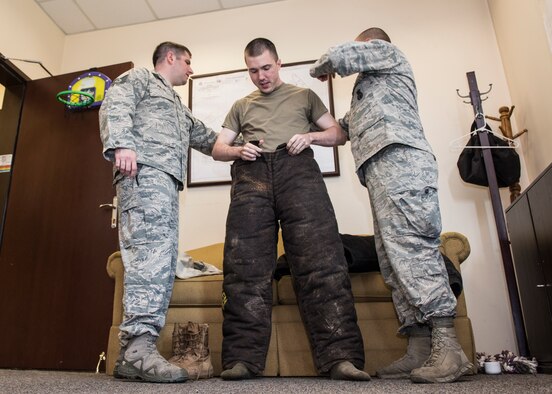INCIRLIK AIR BASE, Turkey – U.S. Army Capt. James Gaffney, 39th Air Base Wing veterinarian, dons a bite suit at Incirlik Air Base, Turkey, June 8, 2018.