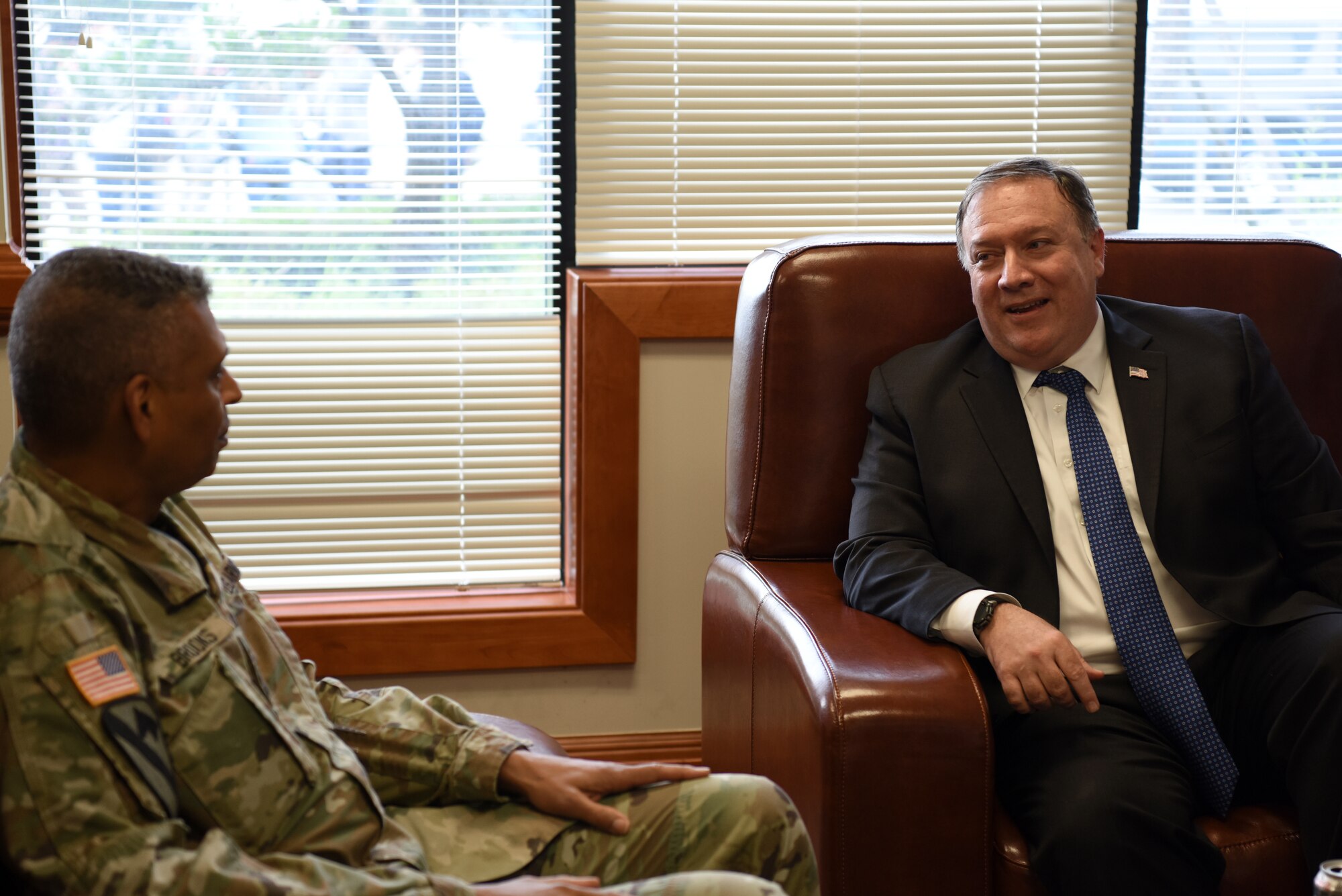 U.S. Secretary of State Mike Pompeo speaks with Gen. Vincent Brooks, United States Forces Korea commander, at Osan Air Base, Republic of Korea, June 13, 2018.