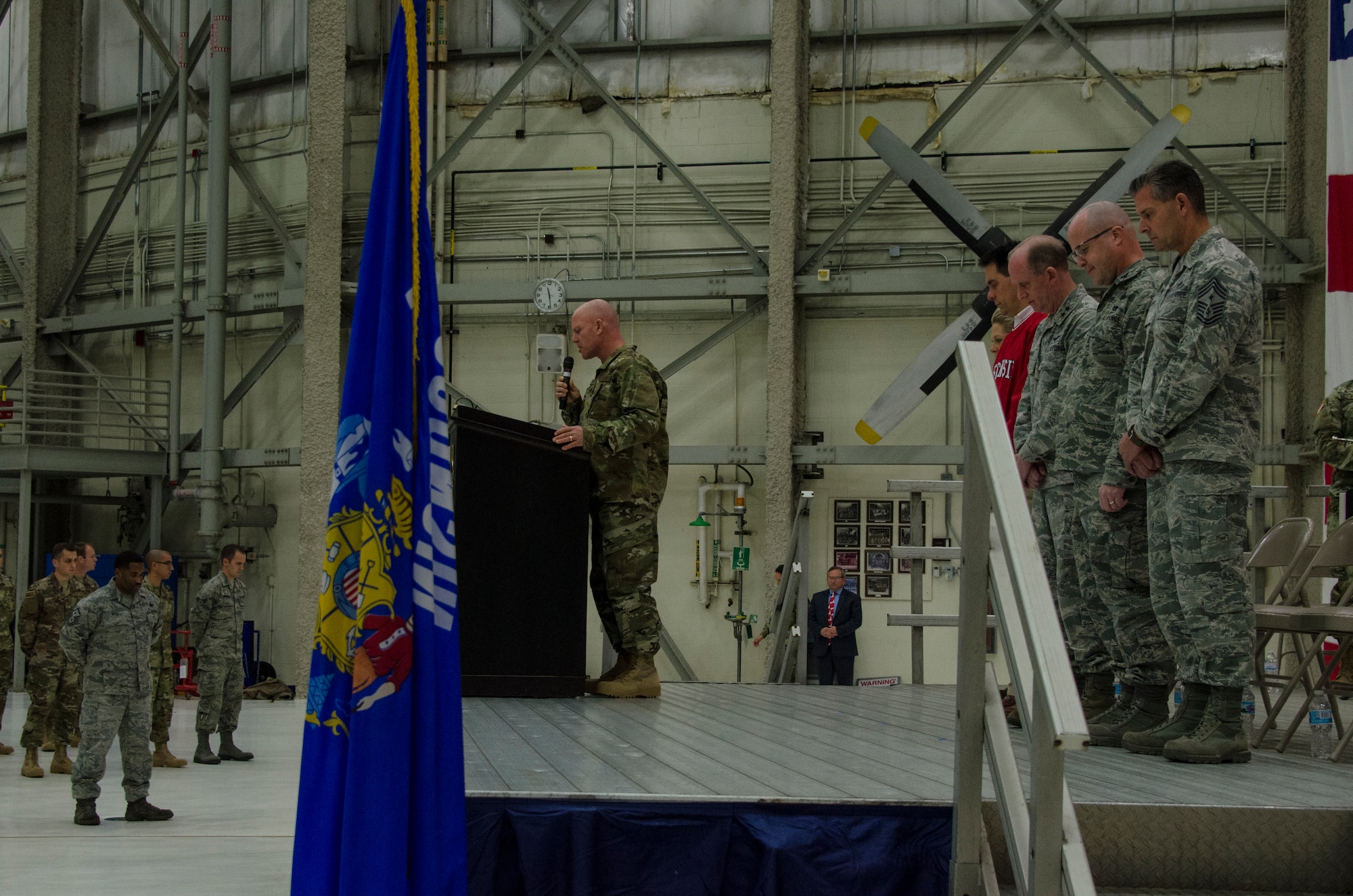 U.S. Air Force Lt. Col. Matthew Friese, wing chaplain of the 128th Air Refueling Wing, Wisconsin Air National Guard, provides the invocation at the beginning of a send-off ceremony at General Mitchell Airfield in Milwaukee, Wisconsin, Dec. 2, 2017.