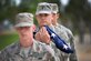 Holding the U.S. flag close, 1st Lt. Michael Jones, crew commander with the 4th Space Operations Squadron, carries the flag during the base retreat ceremony at Schriever Air Force Base, Colorado, June 5, 2018. The ceremony honored the flag and signaled the end of the official duty day. (U.S. Air Force Photo by Dennis Rogers)