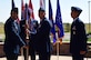 Lt. Col. Otto Mattox, center, 11th Space Warning Squadron outgoing commander, relinquishes the guidon to Col. Lorenzo Bradley, left, 460th Operation Group commander, June 12, 2018, on Buckley Air Force Base, Colorado. The 11 SWS supports the base mission of space-based missile warning alongside the 2nd and 8th Space Warning Squadrons. (U.S. Air Force photo by Senior Airman AJ Duprey)