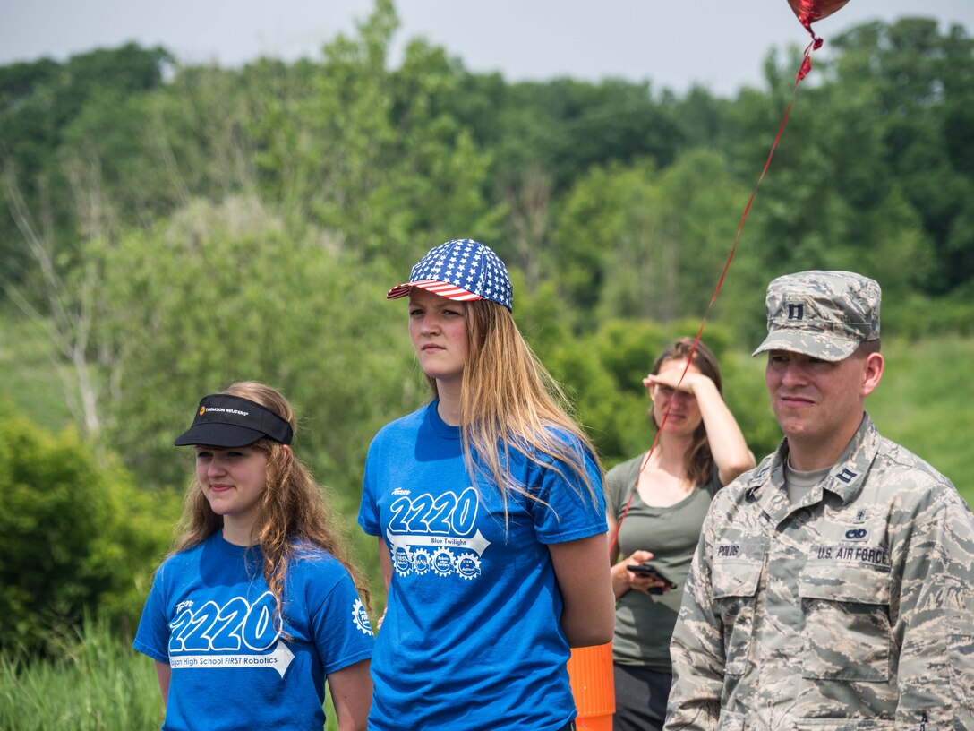 Capt. Jon Polos heps to administer the fitness test for Thomson Reuters employees. (Air Force Photo/Paul Zadach