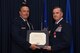 Col. Gregory C. Jones receives a certificate during his retirement ceremony at Naval Air Station Fort Worth Joint Reserve Base, Texas, June 2, 2018. Jones served as the 301st Fighter Wing commander from September 2016 to June 2018. (U.S. Air Force photo by Tech. Sgt. Charles Taylor)