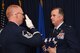 Col. Gregory C. Jones accepts an American flag from an honor guard member during his retirement ceremony at Naval Air Station Fort Worth Joint Reserve Base, Texas, June 2, 2018. Jones served his country for 30 years and retires with more than 4200 flying hours. (U.S. Air Force photo by Tech. Sgt. Charles Taylor)