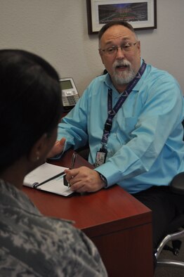 Daniel Pickel, Air Force Reserve Command 433rd Airlift Wing Director of Psychological Health, speaks with an Alamo Wing member in his office at Joint Base San Antonio-Lackland, Texas, Feb. 11, 2018. Pickel provides consultation, training and education, crisis management and therapy to the Reserve Citizen Airmen of the wing. (U.S. Air Force photo by Staff. Sgt. Lauren M. Snyder)