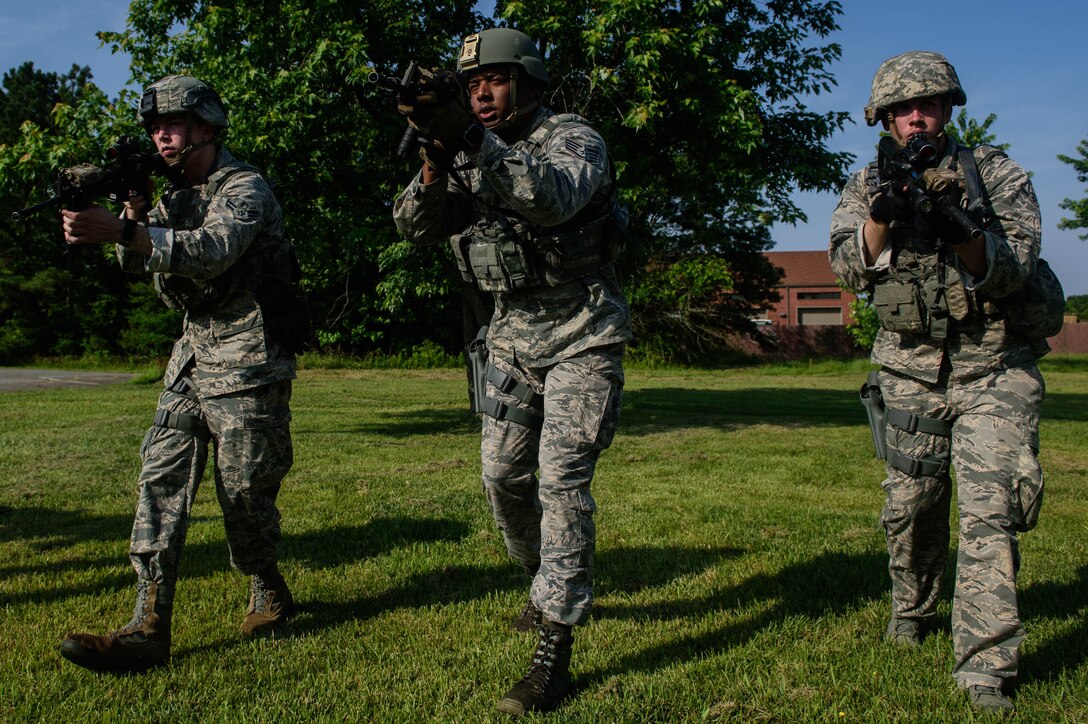 U.S. Air Force Airmen assigned to the 633rd Security Forces Squadron performs muscle memory drills during an emergency services team tryouts at Joint Base Langley-Eustis, Virginia, June 8, 2018. The five first responders learned and practiced squad movement tactics and communication drills to become more effective team members. (U.S. Air Force photo by Senior Airman Derek Seifert)