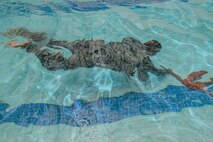 A U.S. Air Force Airman assigned to the 633rd Security Forces Squadron performs water confidence training during the emergency services team tryouts at Joint Base Langley-Eustis, Virginia, June 8, 2018. The tryouts are held every quarter and are available for all first responders on the installation. (U.S. Air Force photo by Senior Airman Derek Seifert)