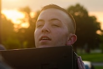 U.S. Air Force Airman 1st Class Nicholas Smoak, 633rd Security Forces Squadron entry controller, performs ammo can presses during the emergency services team tryouts at Joint Base Langley-Eustis, Virginia, June 8, 2018. The tryouts are designed to induce mental and physical stress on the candidates to evaluate how they will act in a fast paced and stressful environment. (U.S. Air Force photo by Senior Airman Derek Seifert)