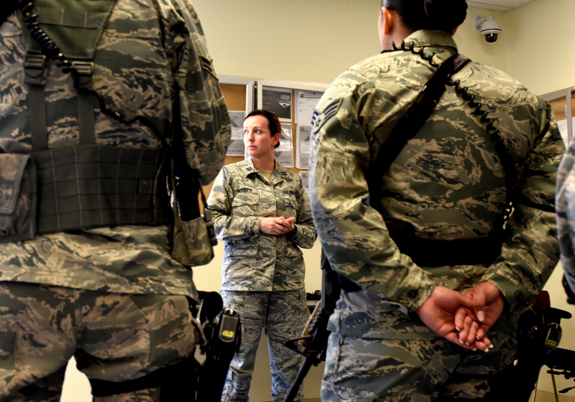 Capt. Malika Moretti, 60th Medical Operations Squadron clinical social worker, visits with 60th Security Forces Squadron members June 11, 2018, at the armory at Travis Air Force Base, Calif. (U.S. Air Force photo/Nick DeCicco)