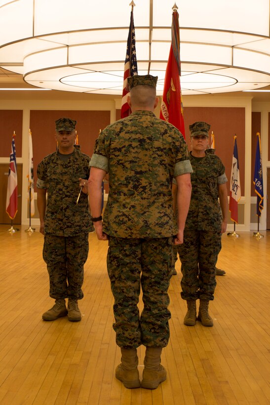 U.S. Marine Corps Sgt. Maj. Rene Salinas, left, sergeant major of II Marine Expeditionary Force Information Group (MIG), prepares to transfer the sword of office to Col. Jordan D. Walzer, commanding officer of II MIG, during a relief and appointment ceremony at Camp Lejeune, N.C., June 8, 2018. After 30 years of service, Salinas relinquished command to Sgt. Maj. Joy M. Kitashima. (U.S. Marine Corps photo by Lance Cpl. Caleb T. Maher)