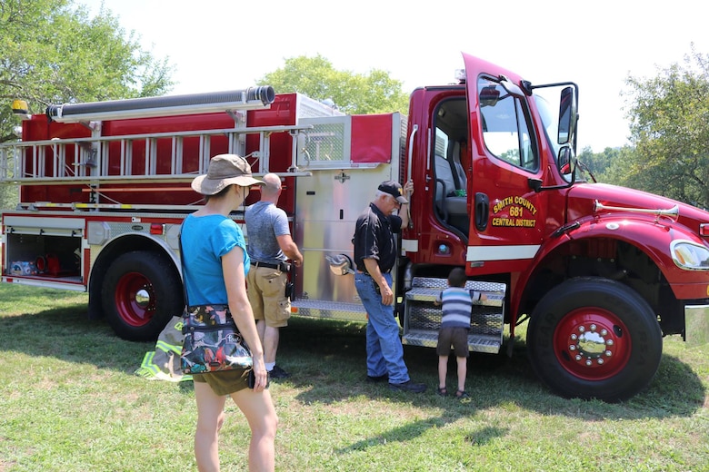 North Central Fire Department and Smith County’s volunteer fire department show kids their bunker gear and truck equipment used to battle fires during the “Touch a Truck” event June 9, 2018 at Cordell Hull Lake in Carthage, Tenn. (USACE Photo by Ashley Webster)