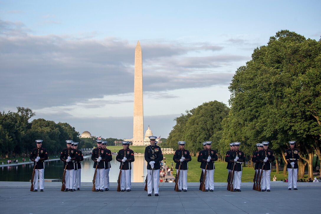 Marines with Bravo Company, Marine Barracks Washington D.C., stand at a ceremonial position during the Sunset Parade at the Lincoln Memorial, Washington D.C., June 12, 2018. This year is the first year the Barracks Marines are hosting Tuesday Sunset Parades at the Lincoln Memorial. The guest of honor for the parade was Secretary of the Interior Ryan Zinke and the hosting official was Robert D. Hogue, counsel for the commandant of the Marine Corps. (Official U.S. Marine Corps photo by Sgt. Robert Knapp/Released)