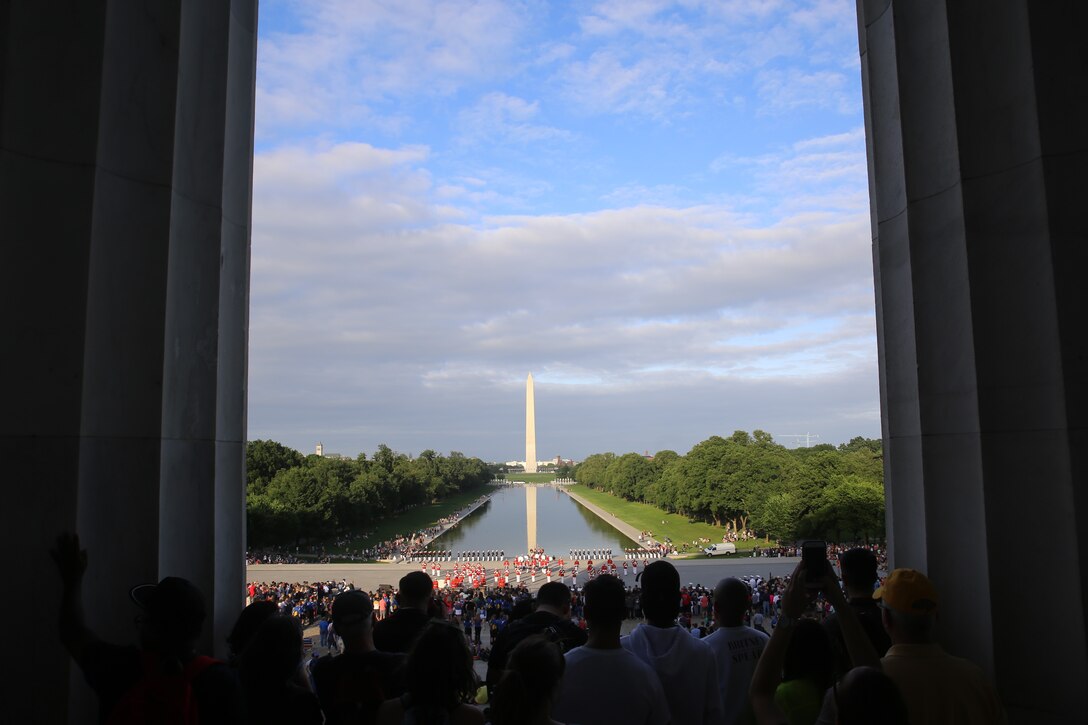 Spectators watch Marines from Marine Barracks Washington perform the Tuesday Sunset Parade from the steps of the Lincoln Memorial in Washington D.C., June 12, 2018. This year is the first year Barracks Marines are hosting Tuesday Sunset Parades at the Lincoln Memorial. The guest of honor for the parade was Secretary of the Interior Ryan Zinke and the hosting official was Robert D. Hogue, counsel for the commandant of the Marine Corps.
