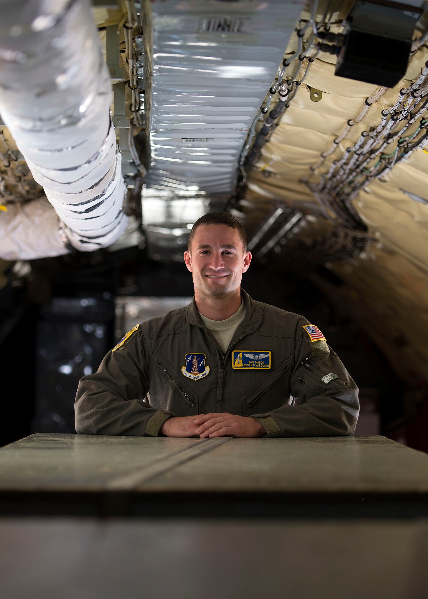 Staff Sgt. Sam J. Mason, a boom operator with the 157th Operations Group, poses for a portrait in a K-C 135 Stratotanker June 13, 2018 at Pease Air National Guard Base, N.H. Mason joined the unit in April after previously serving six years in the Air Force Honor Guard in Washington, DC. (N.H. Air National Guard photo by Airman 1st Class Victoria Nelson)