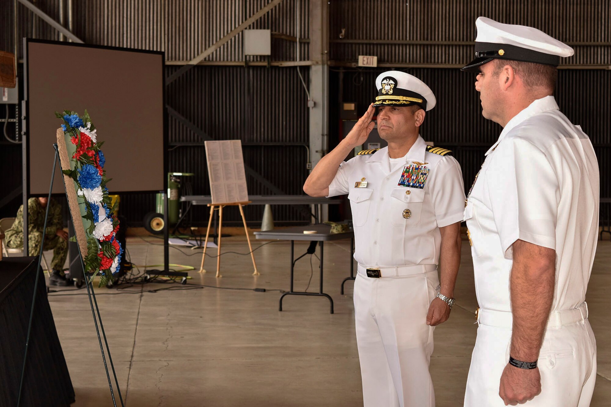 U.S. Navy Capt. M. Muzzafar Khan, Joint Base McGuire-Dix-Lakehurst deputy commander and Naval Support Activity commanding officer, salutes during the 76th Battle of Midway commemoration on Joint Base MDL June 5, 2018. The battle is considered the turning point during World War II in the seas and air near the South Pacific because this was the first battle with carrier to carrier fighting.