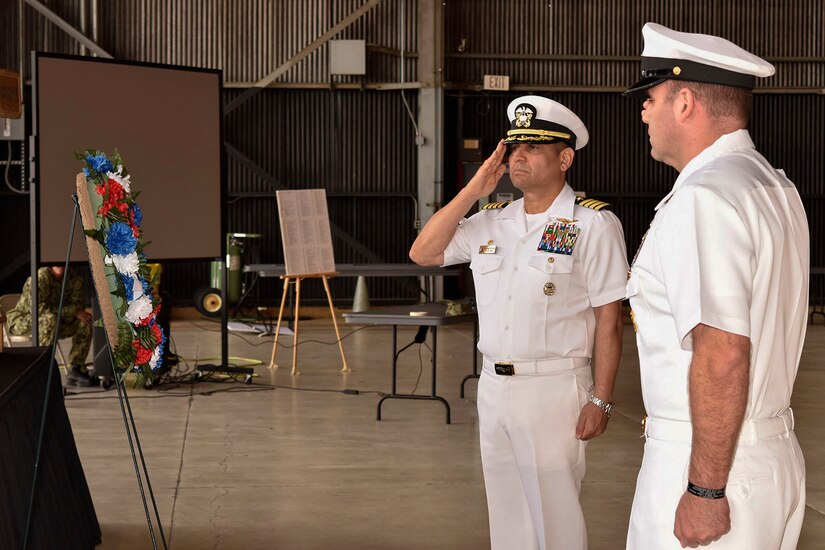 U.S. Navy Capt. M. Muzzafar Khan, Joint Base McGuire-Dix-Lakehurst deputy commander and Naval Support Activity commanding officer, salutes during the 76th Battle of Midway commemoration on Joint Base MDL June 5, 2018. The battle is considered the turning point during World War II in the seas and air near the South Pacific because this was the first battle with carrier to carrier fighting.