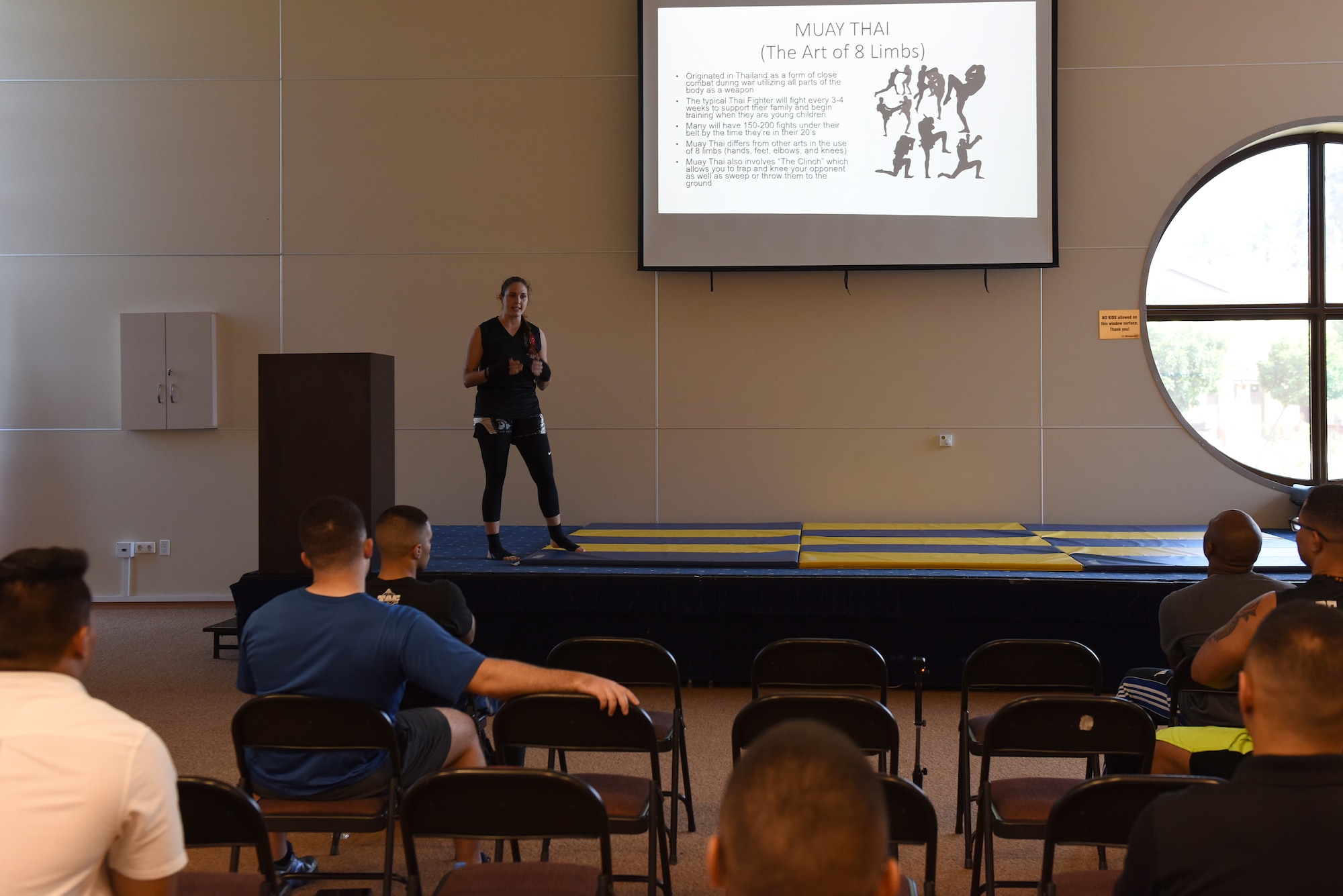 U.S. Air Force Staff Sgt. Iiae Hess, 39th Operations Support Squadron air traffic controller, speaks to attendees about Muay Thai during a mixed martial arts workshop at Incirlik Air Base, Turkey, June 9, 2018.