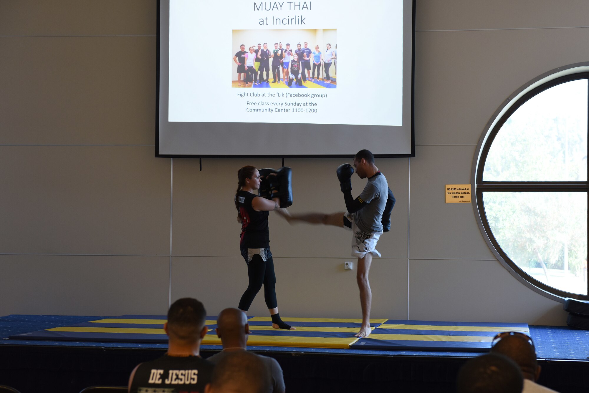 U.S. Air Force Staff Sgt. Iiae Hess, 39th Operations Support Squadron air traffic controller, and her assistant, U.S. Air Force Staff Sgt. Korey McConnell, 39th Force Support Squadron manpower analyst, demonstrate Muay Thai maneuvers during a mixed martial arts workshop at Incirlik Air Base, Turkey, June 9, 2018.