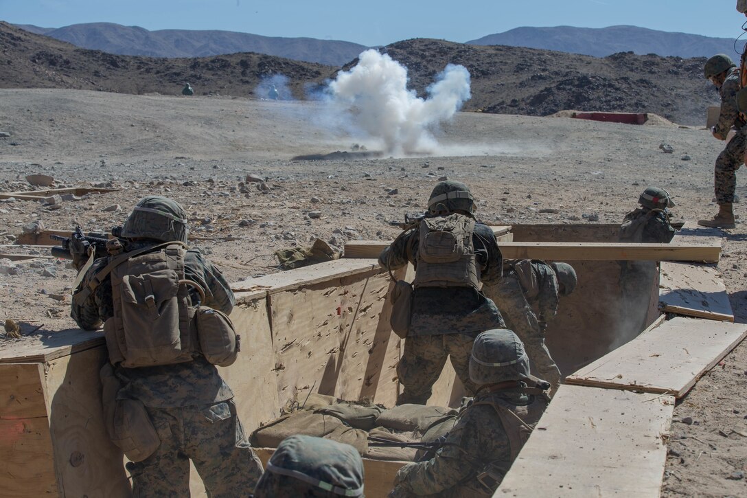 Marines with Alpha Company, 1st Battalion, 23rd Marine Regiment, 4th Marine Division, conduct live-fire drills on range 410A, a platoon reinforced attack range, during Integrated Training Exercise 4-18 at Marine Corps Air Ground Combat Center Twentynine Palms, California, June 11, 2018.