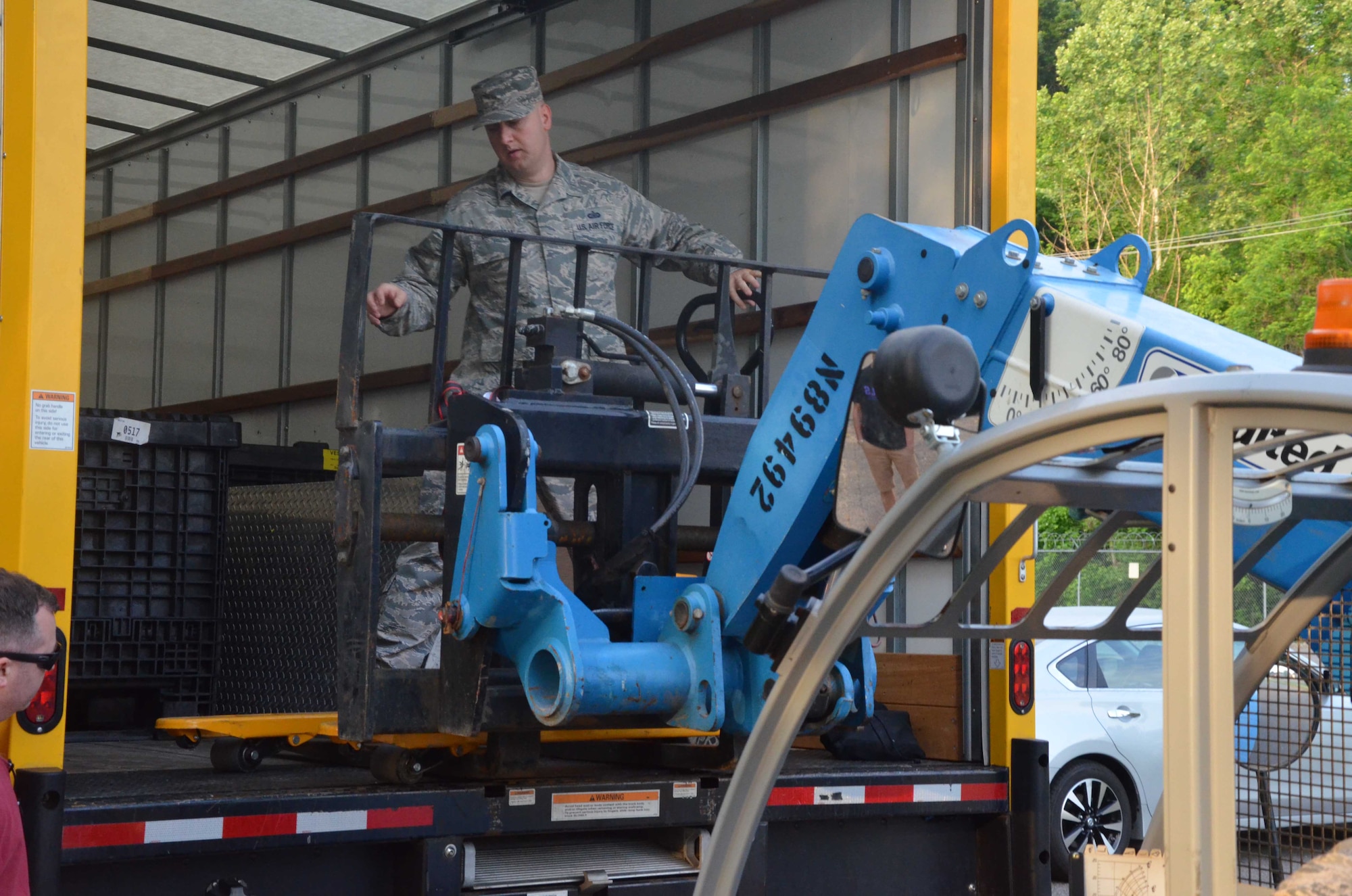 Staff Sgt. Beau Brennan, a member of the Air Force Technical Applications Center's contingency operations (COOP) relocation team, unloads equipment onto a forklift at Joint Base San Antonio-Lackland in support of AFTAC's COOP mission transfer from JBSA to Naval Support Activity Mid-South in Millington, Tenn.  (U.S. Air Force photo by Marvin T. Crumpton)