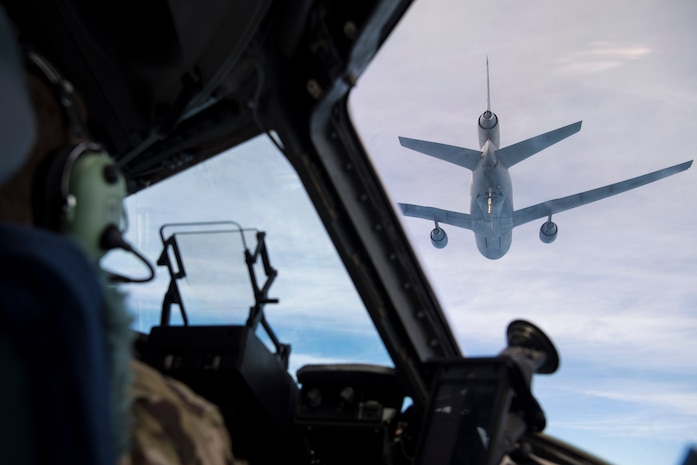 U.S. Air Force Lt. Col. Michael B. Lewis and 1st Lt. Douglas Urbino, pilots, assigned to the 15th and 16th Airlift Squadrons, Joint Base Charleston, S.C., pilot a C-17 Globemaster III during an air-refueling  during Exercise Swift Response 18 (SR18) June 8, 2018. SR18 is one of the premier military crisis response training events for multinational airborne forces in the world that demonstrates the ability of America's Global Response Force to work hand-in-hand with joint and total force partners. (U.S. Air Force photo by Airman First Class Gracie I. Lee)