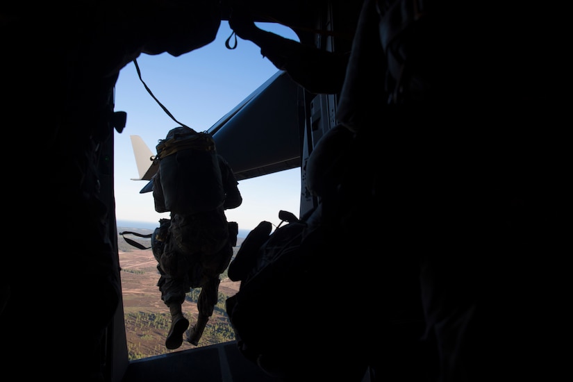 A U.S. Army paratrooper assigned to the 82nd Airborne Division, Fort Bragg, N.C., jumps from a C-17 Globemaster III over Latvia, during Exercise Swift Response 18 (SR18) June 8, 2018. SR18 is one of the premier military crisis response training events for multinational airborne forces in the world that demonstrates the ability of America's Global Response Force to work hand-in-hand with joint and total force partners. (U.S. Air Force photo by Airman First Class Gracie I. Lee)
