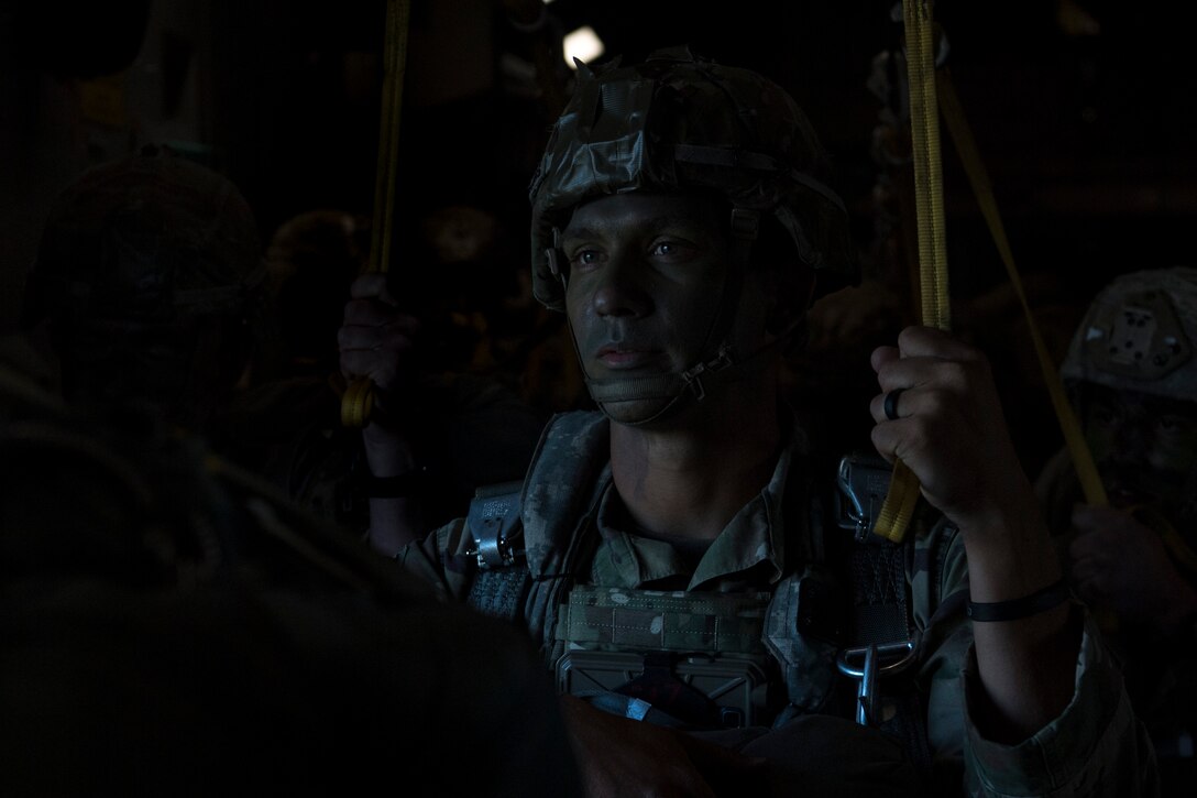 U.S. Army Staff Sgt. Justin Chavis, jumpmaster, assigned to the 82nd Airborne Division, Fort Bragg, N.C., prepares to jump from a C-17 Globemaster III over Latvia, during Exercise Swift Response 18 (SR18) June 8, 2018. SR18 is one of the premier military crisis response training events for multinational airborne forces in the world that demonstrates the ability of America's Global Response Force to work hand-in-hand with joint and total force partners. (U.S. Air Force photo by Airman First Class Gracie I. Lee)