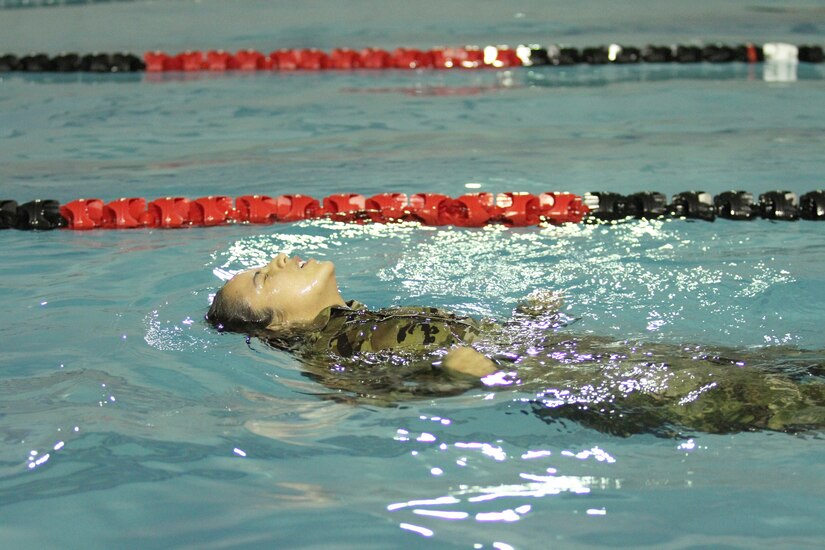 Pfc. Maria Litterio, assigned to the 97th Transportation Company at Fort Eustis, Virginia, swam the backstroke in the German Armed Forces Proficiency Badge 100-meter swim. Litterio was one of more than 75 Soldiers and Airmen who strived to earn the badge for military proficiency. (U.S. Army Reserve photo by Sgt. 1st Class Emily Anderson, 80th Training Command)