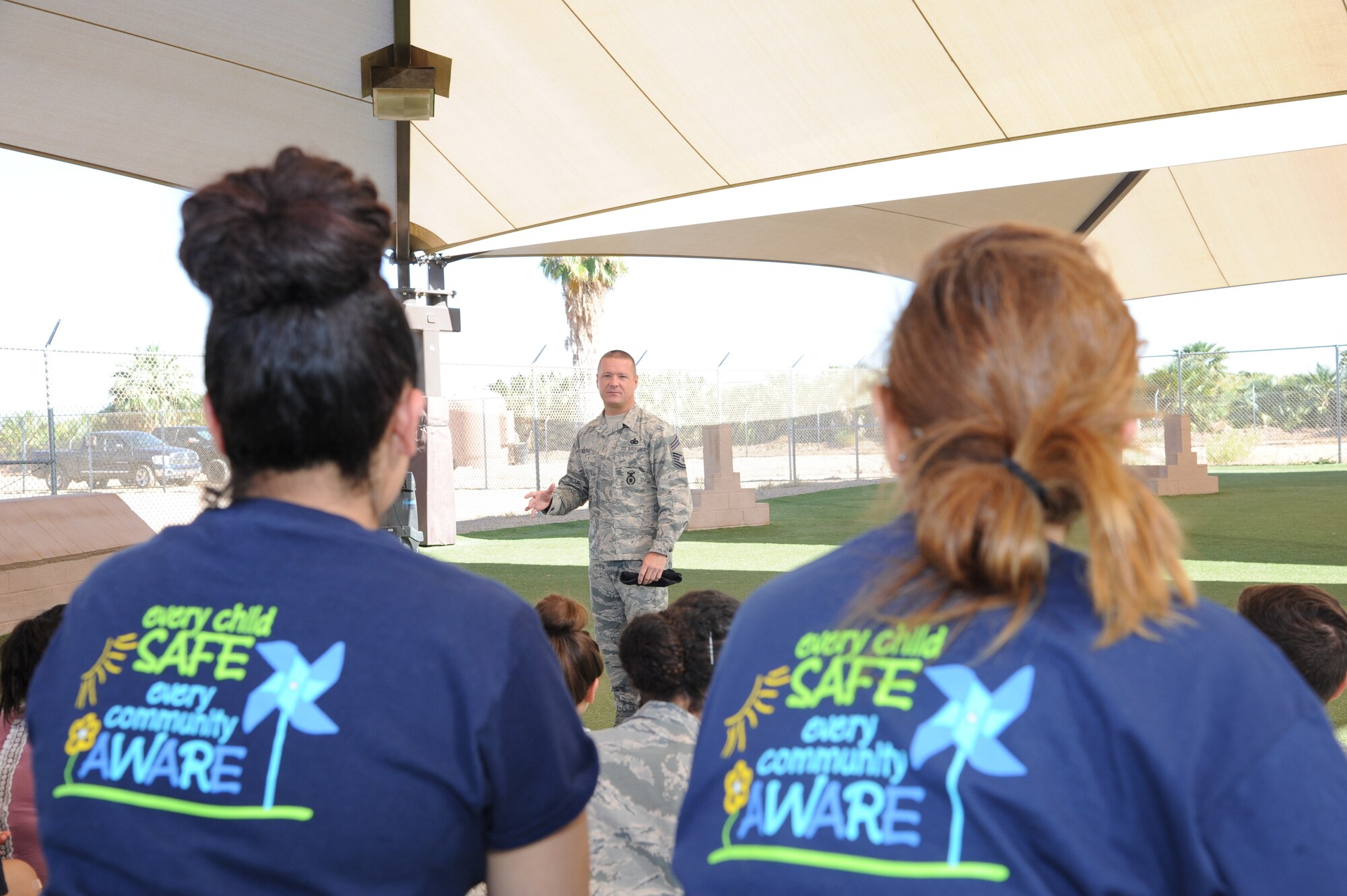 Chief Master Sgt. Donnie Bolton, 56th Security Forces Squadron manager, welcomes the children of Childhelp at the 56th SFS Military Working Dog kennels at Luke Air Force Base, Ariz., June 12, 2018. Childhelp is a nonprofit organization dedicated to helping victims of child abuse, neglect and at-risk children. (U.S. Air Force photo by Tech. Sgt. Luther Mitchell)