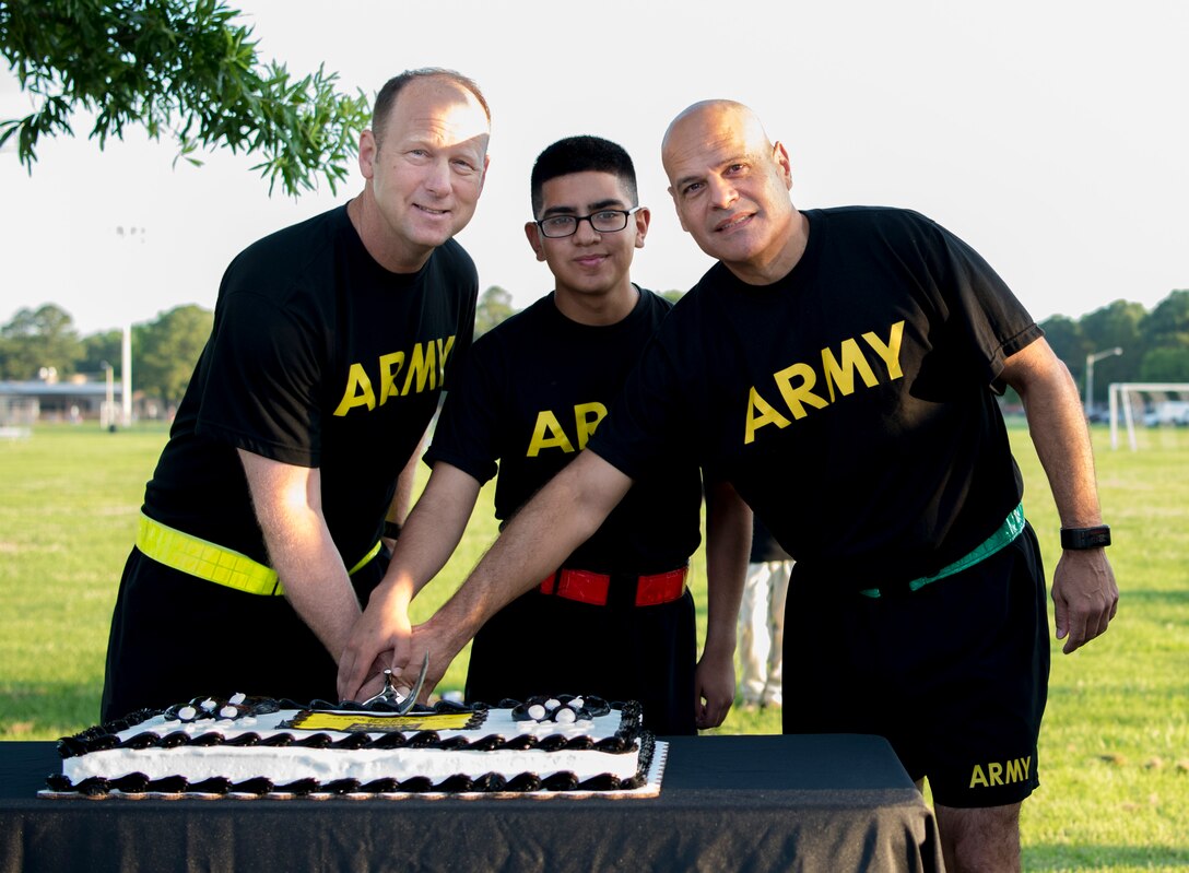 U.S. Army Col. Ralph L. Clayton, 733rd Mission Support Group commander, left, and Command Sgt. Maj. Eric Vidal, 733rd Mission Support Group command sergeant major, right, honor the Army’s 243rd birthday with a cake cutting ceremony at Joint Base Langley-Eustis, Virginia., June 14, 2018.