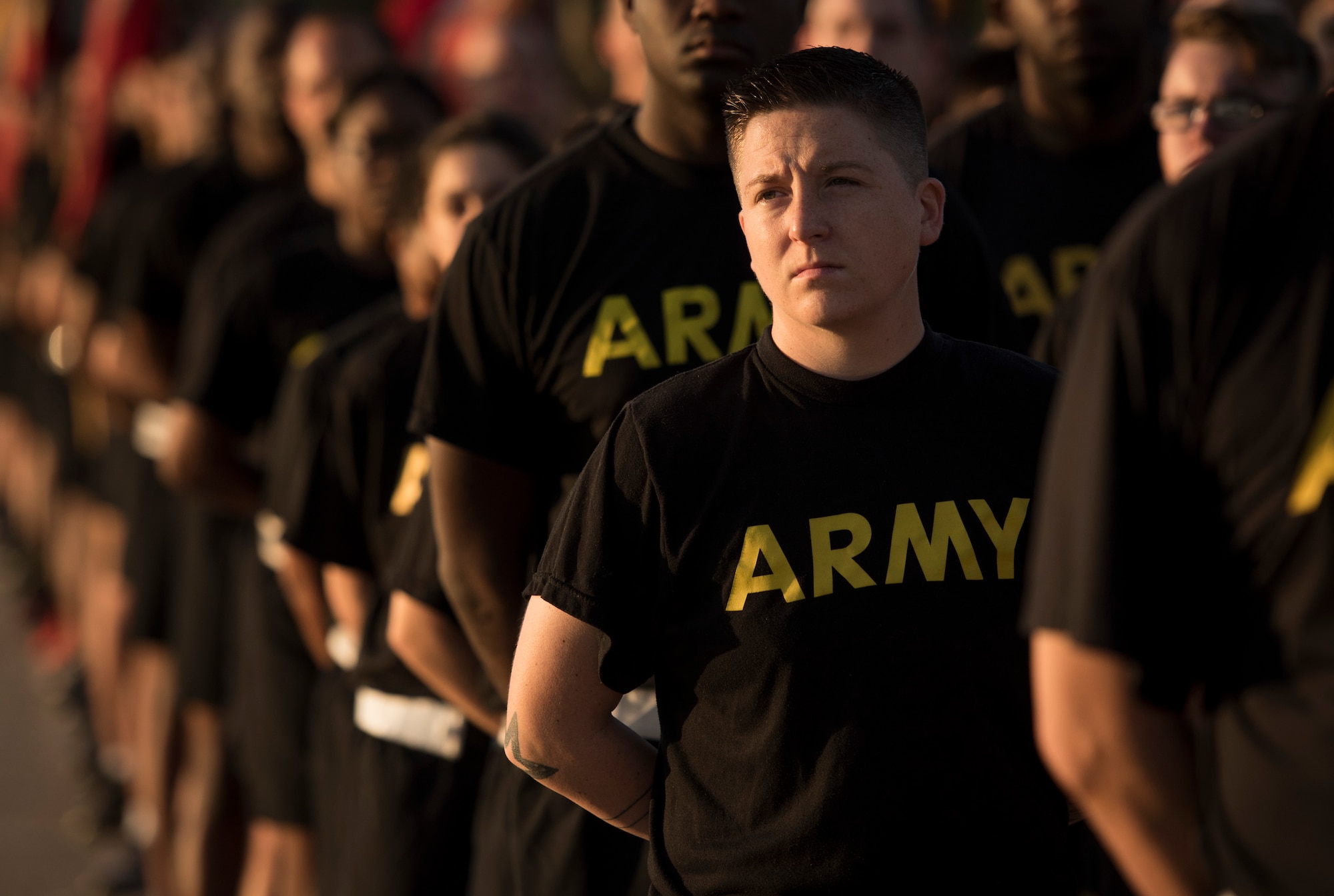U.S. Army Soldiers stand listening to the opening remarks during the Army 243rd Birthday Run Celebration at Joint Base Langley-Eustis, Virginia, June 14, 2018.