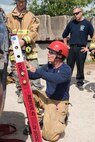“Train the Trainer” vehicle extrication course instructor Ron Moore explains different techniques to the participating firefighters June 8, 2018, at Camp Talon, Joint Base San Antonio-Randolph. Moore explained the importance of stabilizing overturned vehicles and showed them different stabilizing techniques. (U.S. Air Force photo by: Airman Shelby Pruitt.)