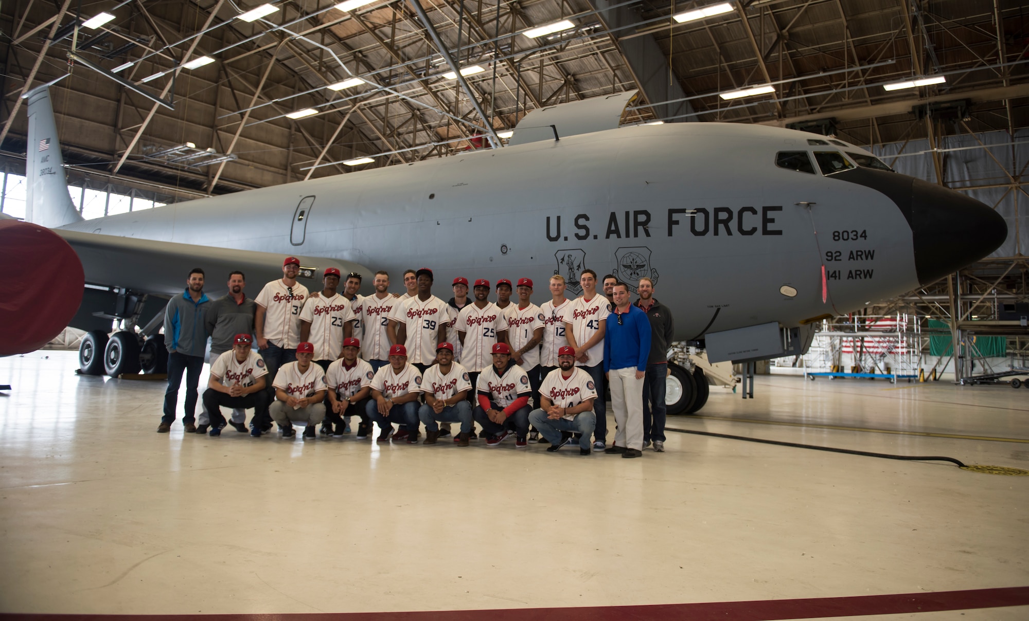 The Spokane Indians Baseball team take a group photo in front of a KC-135 Stratotanker at Fairchild Air Force Base, Wash. June 12, 2018. Not only did the Spokane Indians learn about the importance of teamwork in the military during their base tour, they also had the opportunity to catch a glimpse of how young men and women in uniform serve their country. (U.S. Air Force photo/Senior Airman Sean Campbell)