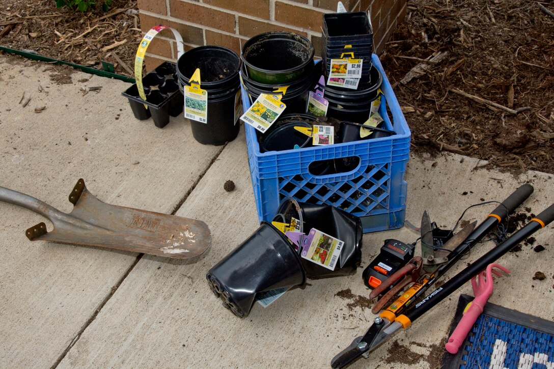 Empty flower containers and an assorted array of gardening tools wait to be cleaned outside a 913th Airlift Group building June 8, 2018, at Little Rock Air Force Base, Ark.