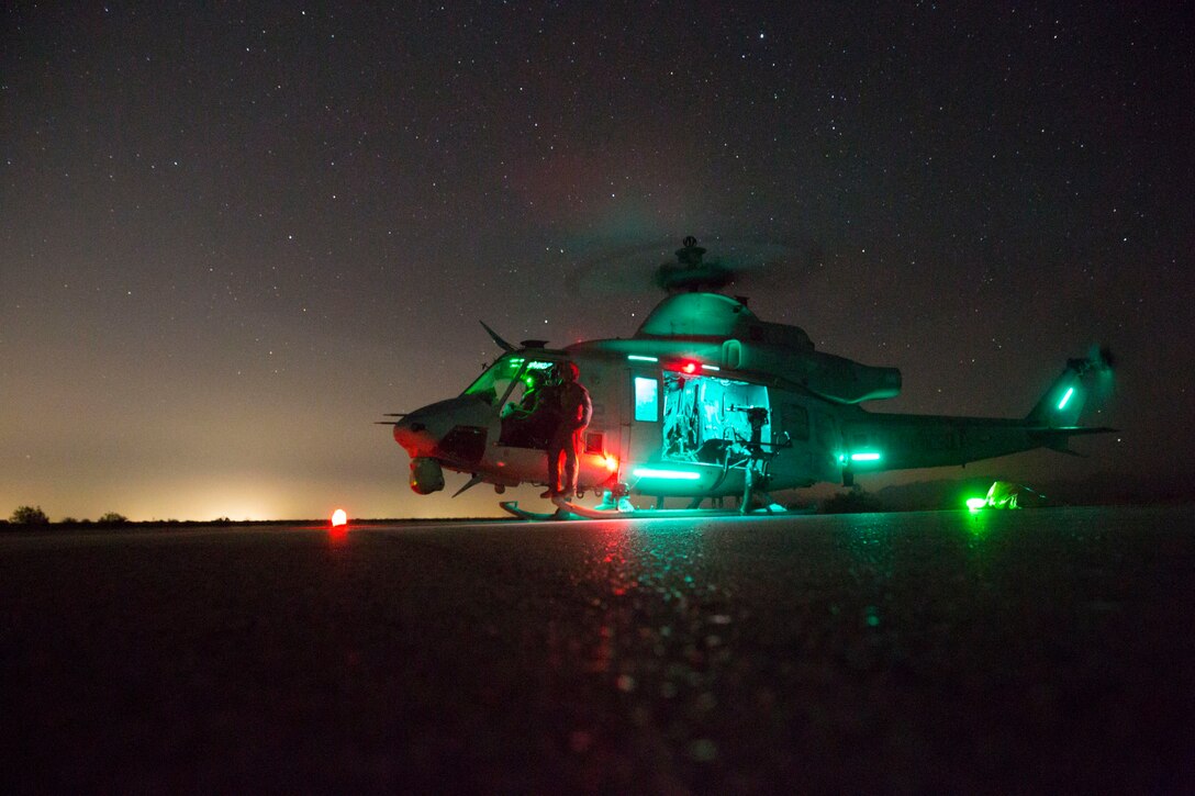 Capt. Mark Reaser, a UH-1Y Venom pilot with Marine Medium Tiltrotor Squadron 166 Reinforced, 13th Marine Expeditionary Unit (MEU), stands beside the helicopter after refueling at a forward arming and refueling point in Yuma, Arizona, June 9, 2018. The Essex Amphibious Ready Group (ARG) and 13th MEU are conducting Composite Training Unit Exercise (COMPTUEX), the final exercise before the units’ upcoming deployment. This exercise validates the ARG/MEU team’s ability to adapt and execute missions in ever-changing, unknown environments. Upon completion of COMPTUEX, the 13th MEU and Essex ARG will be certified as the nation’s premier forward-deployed, crisis response force, capable of executing missions across the broad spectrum of military operations.