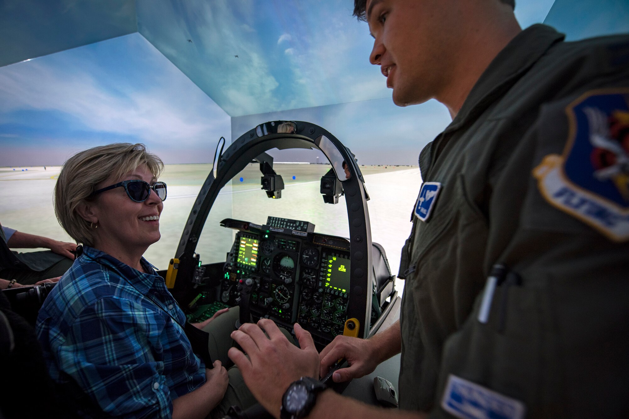 Annette Clayton, Joint Civilian Orientation Course 88 (JCOC) member, discusses her A-10C Thunderbolt II simulator flight experience with Capt. Kyle Hill, 74th Fighter Squadron A-10C pilot, June 13, 2018, at Moody Air Force Base, Ga. The mission of JCOC is to increase the public’s understanding of the military through engagements between the armed forces and course members. (U.S. Air Force photo by Airman 1st Class Eugene Oliver)