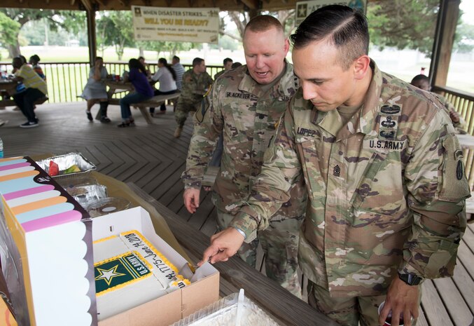 Sgt. Maj. Fransisco Lopez, 841st Transportation Battalion command sergeant major, cuts the cake celebrating the Army's 243rd birthday as Lt. Col. Chad Blacketer, 841st Trans Bn. commander looks on during the unit's celebration of the Army birthday June 14, 2018 at the Joint Base Charleston Naval Weapons Station, S.C. The birthday commemorates the date in 1775 when the Continental Congress authorized enlistment of expert riflemen to serve the United Colonies for one year. At the time, the Army was comprised of 22,000 militiamen gathered outside of Boston, plus 5,000 more in New York. Today, the Army has about 467,000 active duty soldiers, with another 343,000 in the U.S. Army National Guard and 206,000 in the Army Reserves.