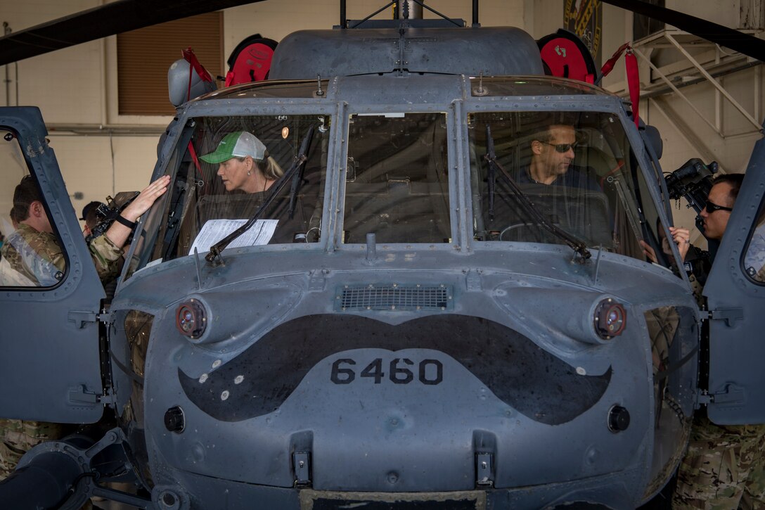 Members of the Joint Civilian Orientation Course 88 (JCOC) converse with pilots from the 41st Rescue Squadron during a question and answer session featuring static displays, June 13, 2018, at Moody Air Force Base, Ga. The mission of JCOC is to increase the public’s understanding of the military through engagements between the armed forces and course members. (U.S. Air Force photo by Senior Airman Daniel Snider)