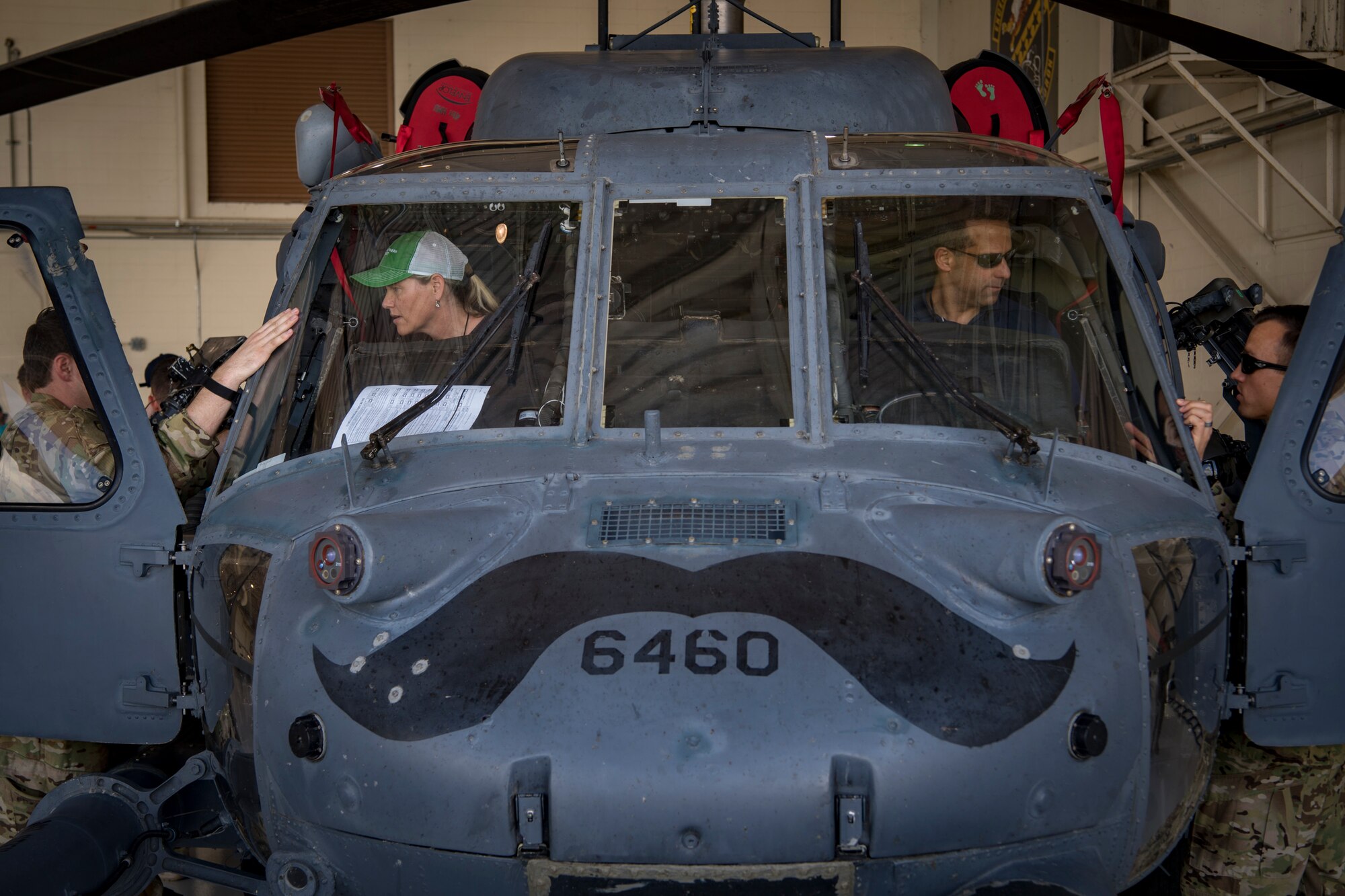 Members of the Joint Civilian Orientation Course 88 (JCOC) converse with pilots from the 41st Rescue Squadron during a question and answer session featuring static displays, June 13, 2018, at Moody Air Force Base, Ga. The mission of JCOC is to increase the public’s understanding of the military through engagements between the armed forces and course members. (U.S. Air Force photo by Senior Airman Daniel Snider)