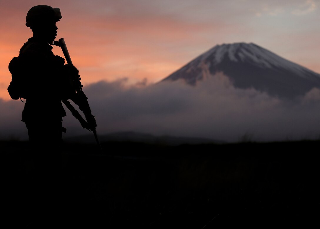 A U.S. Marine with Headquarters Battery, 3rd Battalion, 12th Marine Regiment, 3rd Marine Division posts security